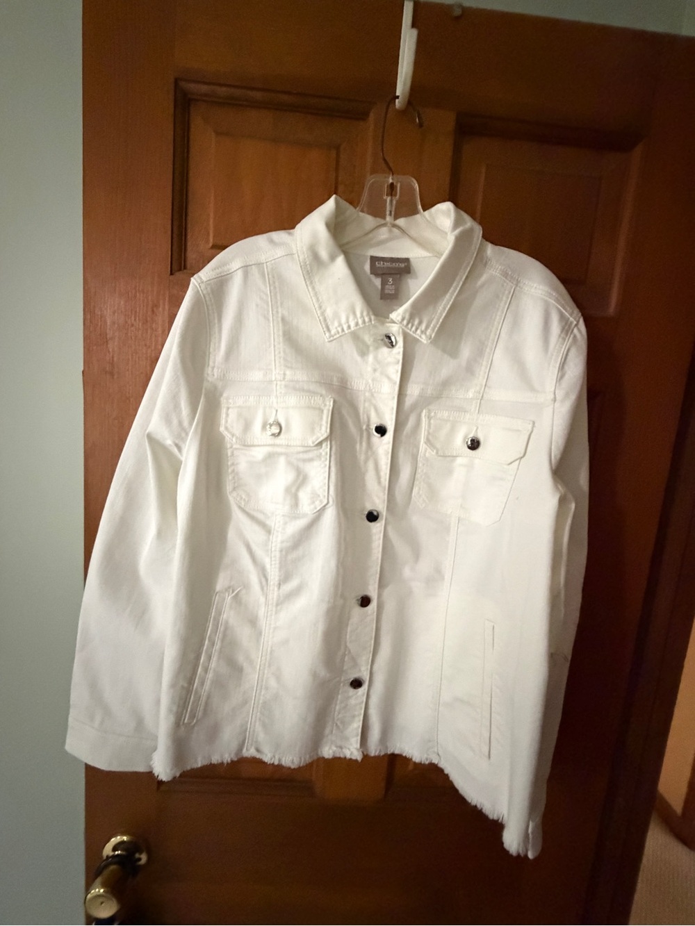 Chico’s White stretch jacket with fringe hem.  Size 3.   Never Wirn